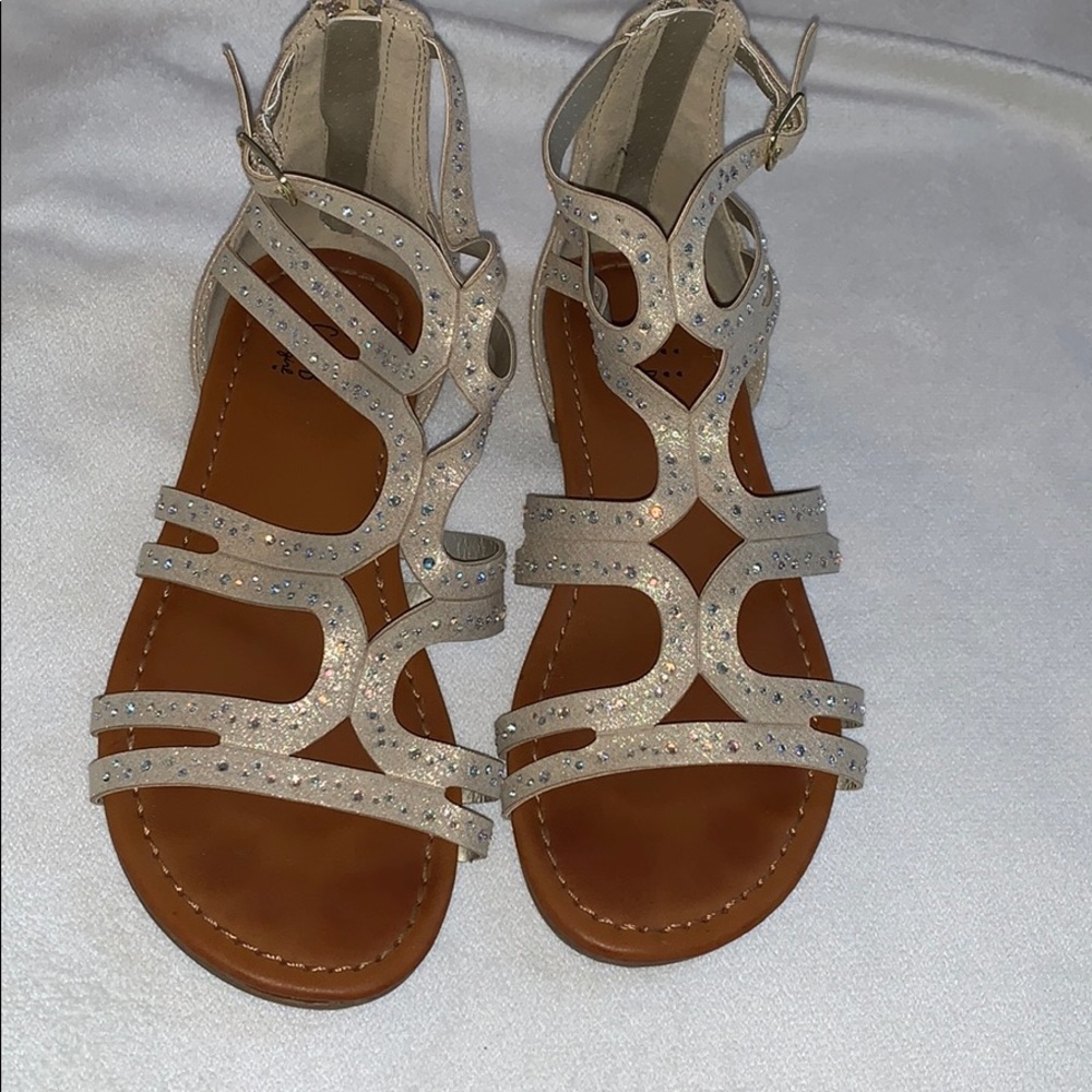 A pair of CRB sandals with small!